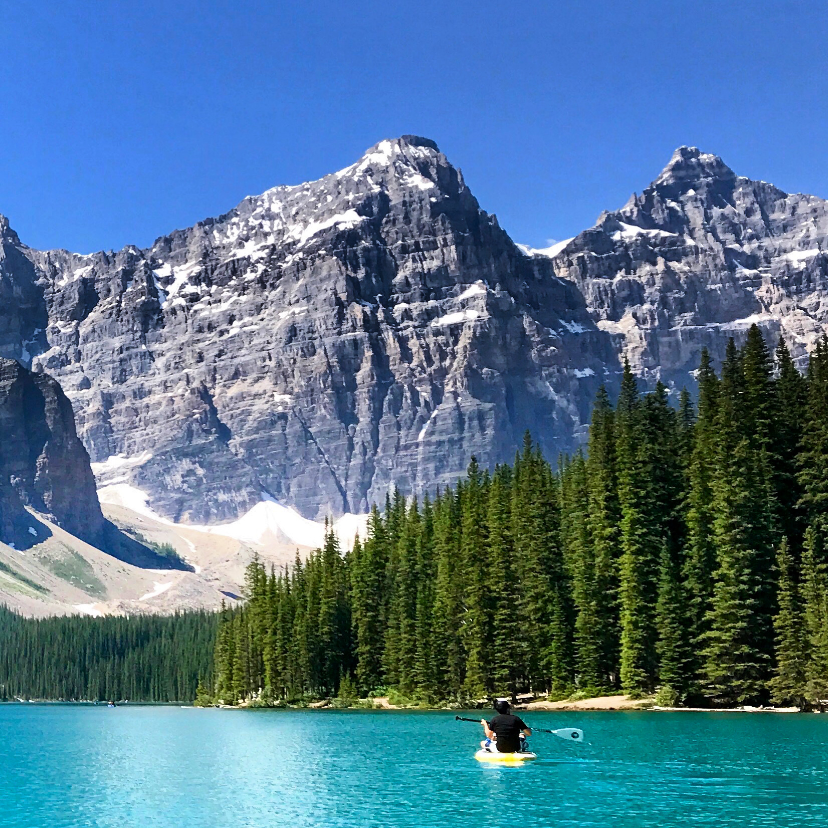 Moraine Lake · Banff National Park · Alberta · Wilson’s son paddling, accurately representing The Rockies to the Pacific